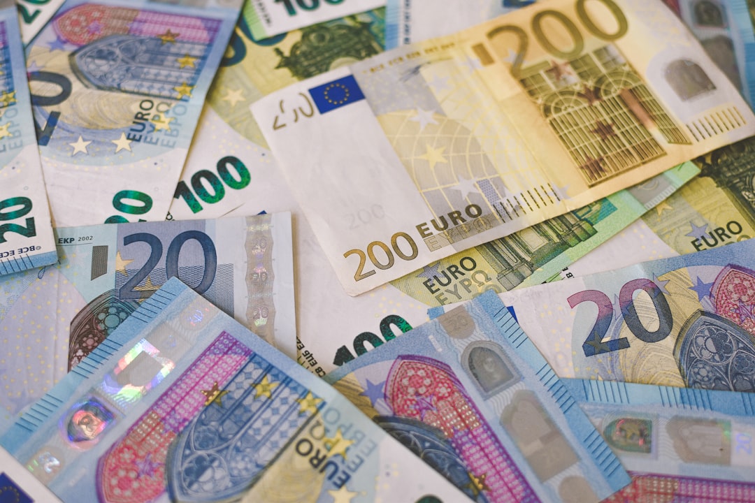 A pile of euro banknotes in 20, 100 and 200 denominations.