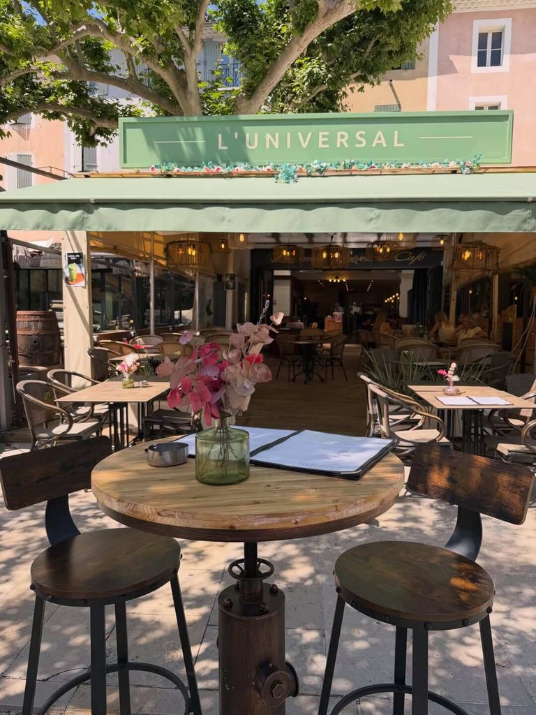 Outdoor café in Roussillon with ochre-coloured village buildings