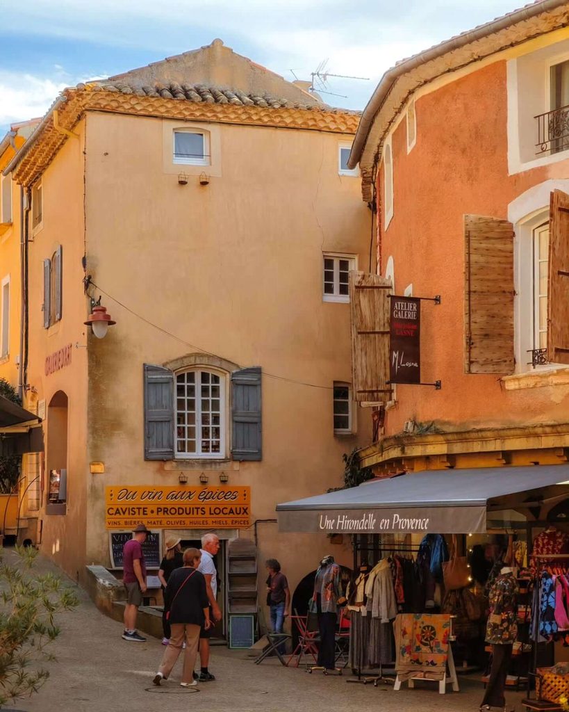 Visitors enjoying a café and the streets of Roussillon during a half-day visit