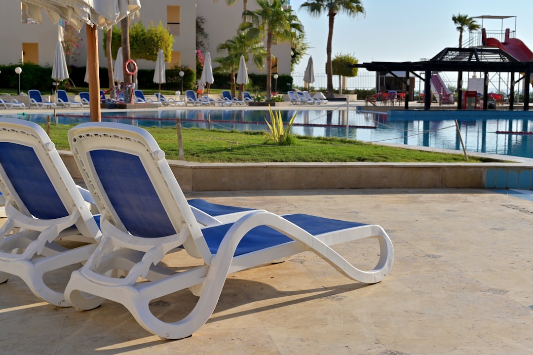 Sun loungers beside a hotel resort pool