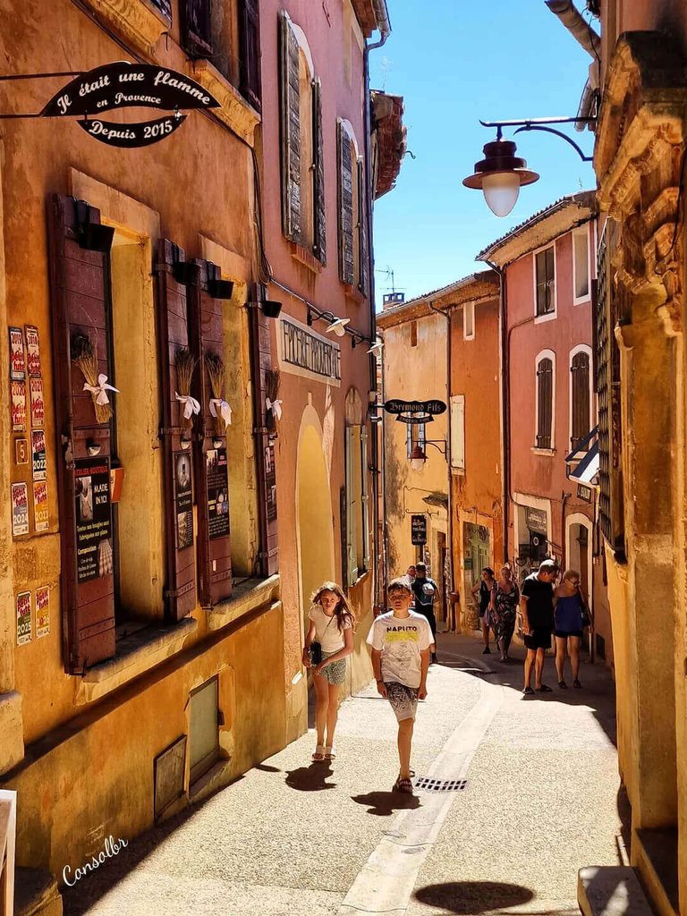 Roussillon village surrounded by green countryside in spring