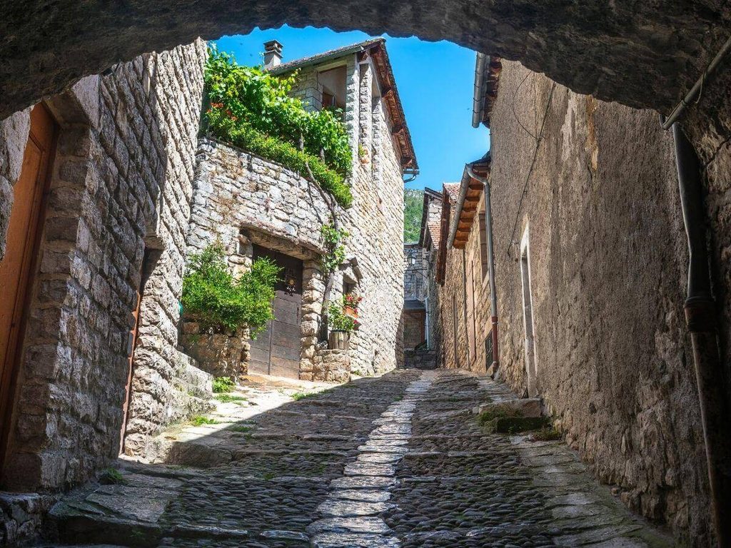 Traditional calade stone paving on a steep street in Sainte-Enimie
