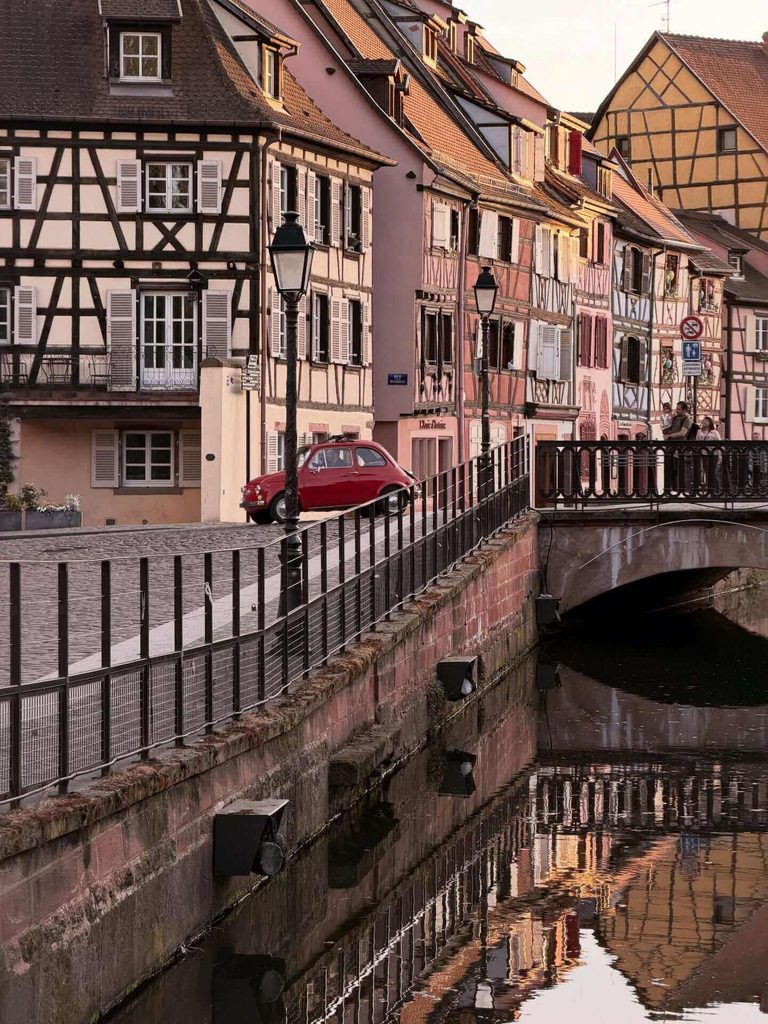 Historic centre of Colmar with cafés and traditional buildings