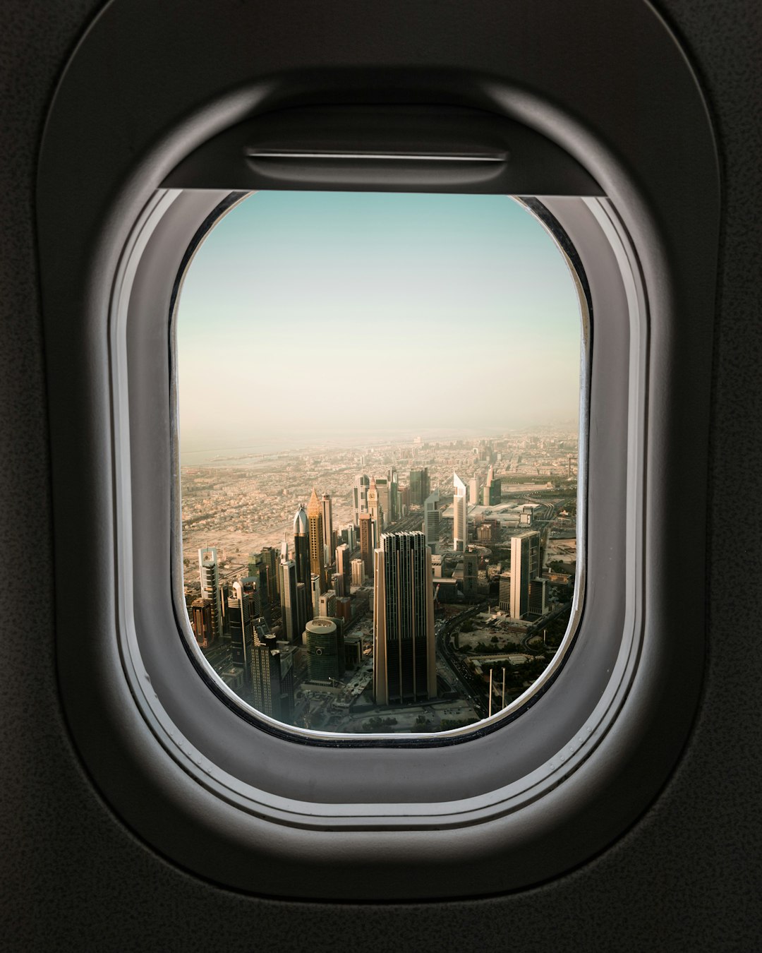 Aerial view of a city from an airplane window during the flight
