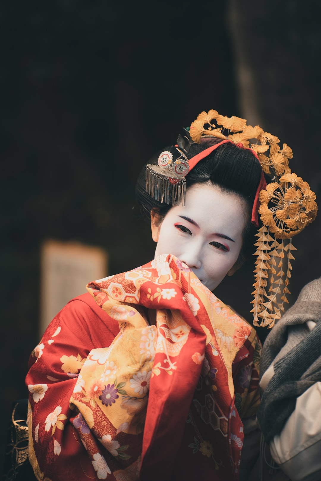 Woman in a kimono walking along a street in Kyoto
