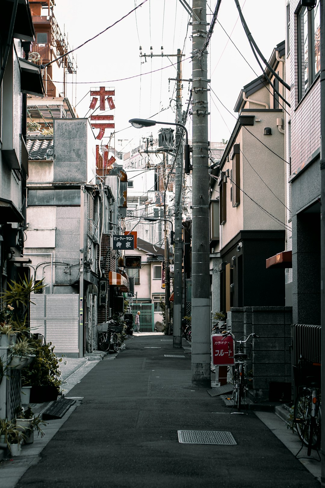 Quiet narrow street between buildings in a Japanese city