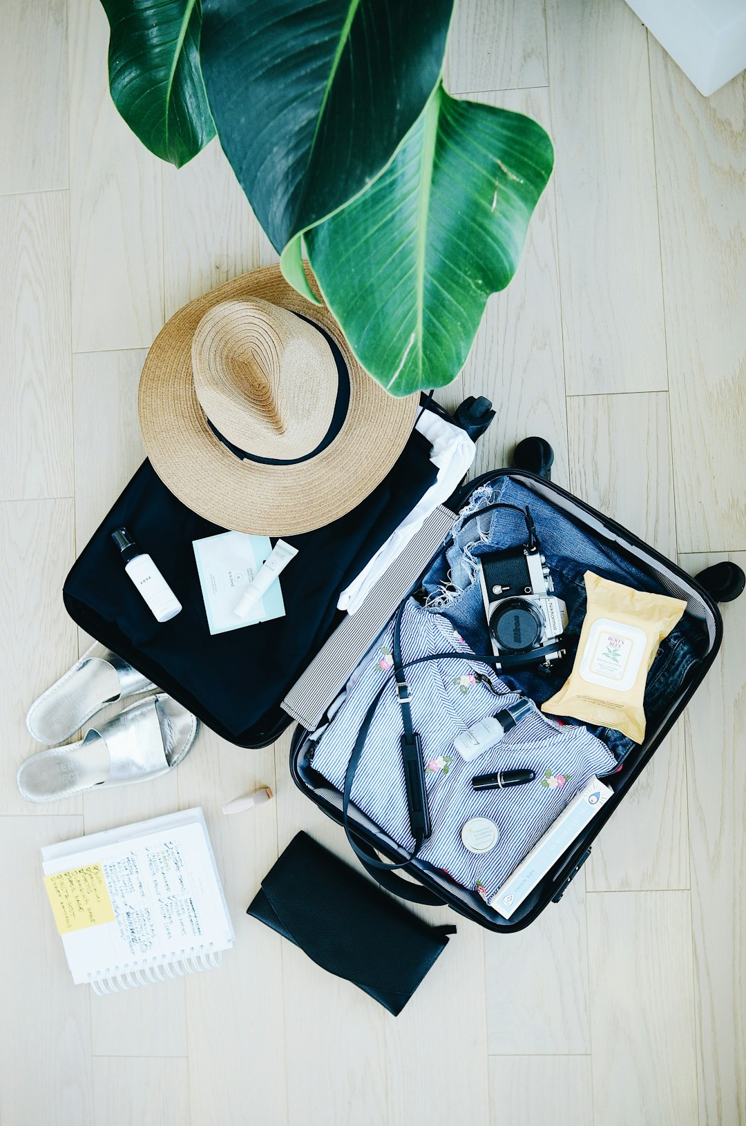 A carry-on suitcase packed and ready for a trip