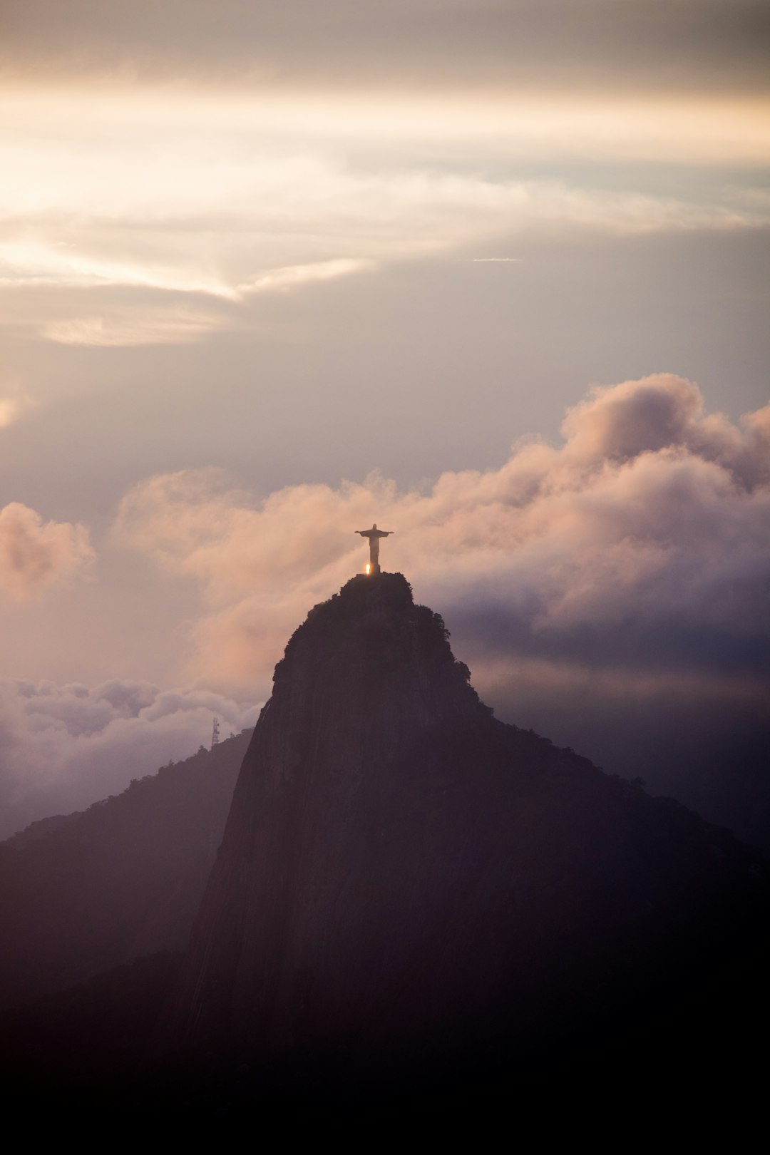 The Christ the Redeemer statue above Rio de Janeiro at sunset