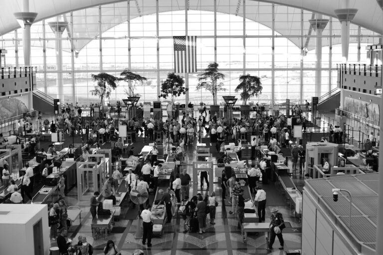 Travelers moving through the TSA security checkpoint at Denver International Airport