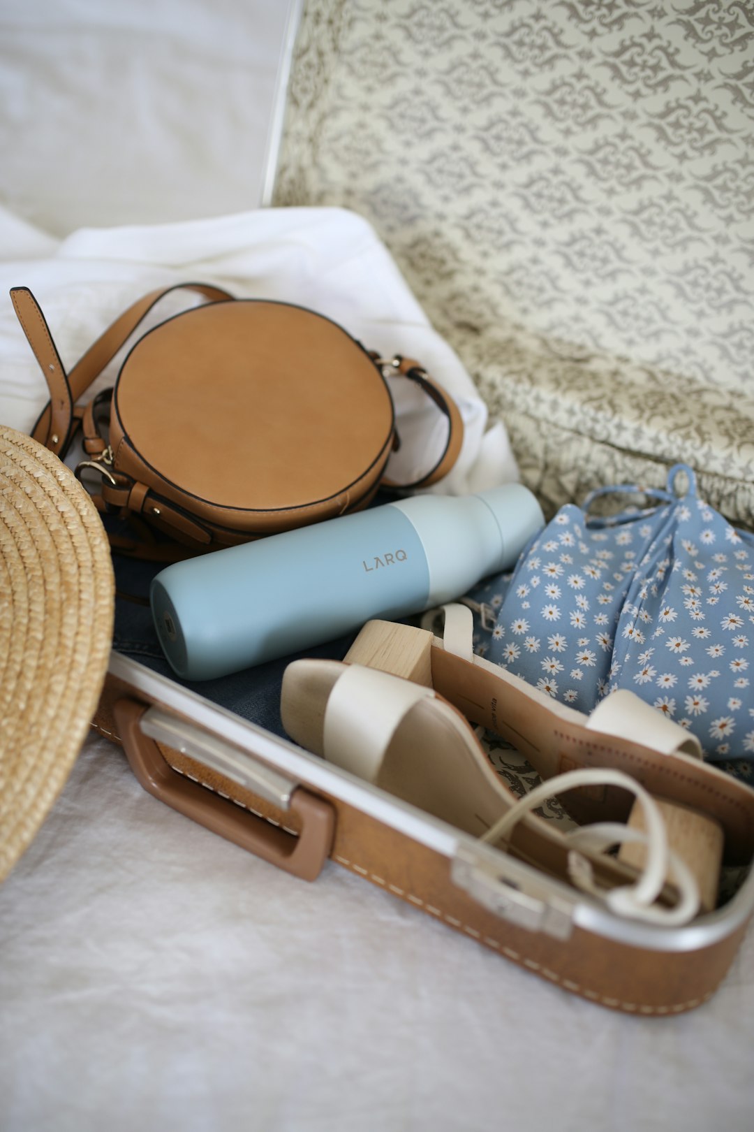 Summer travel essentials water bottle larq bottle packing for trip