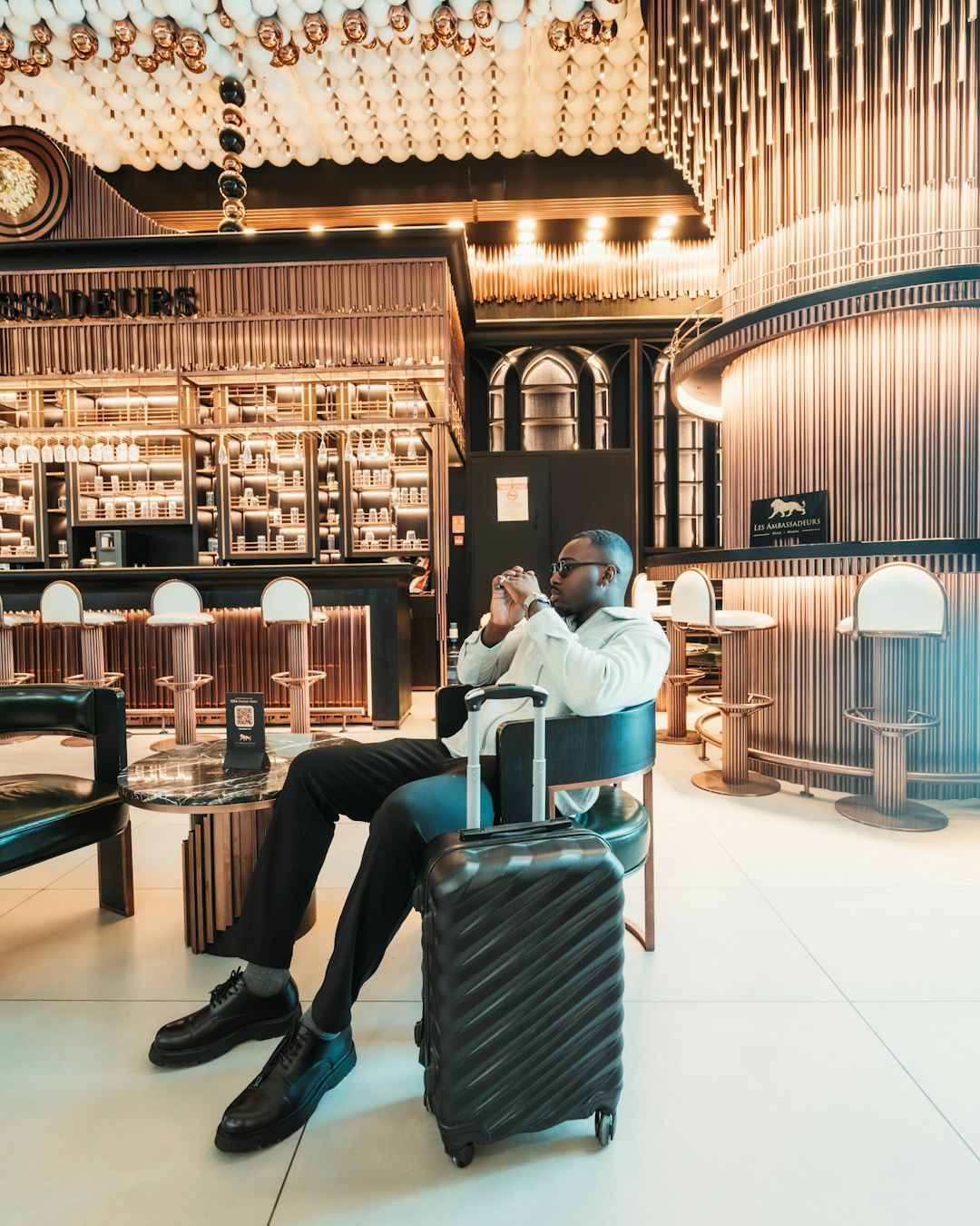 A traveler relaxing in an airport lounge seat