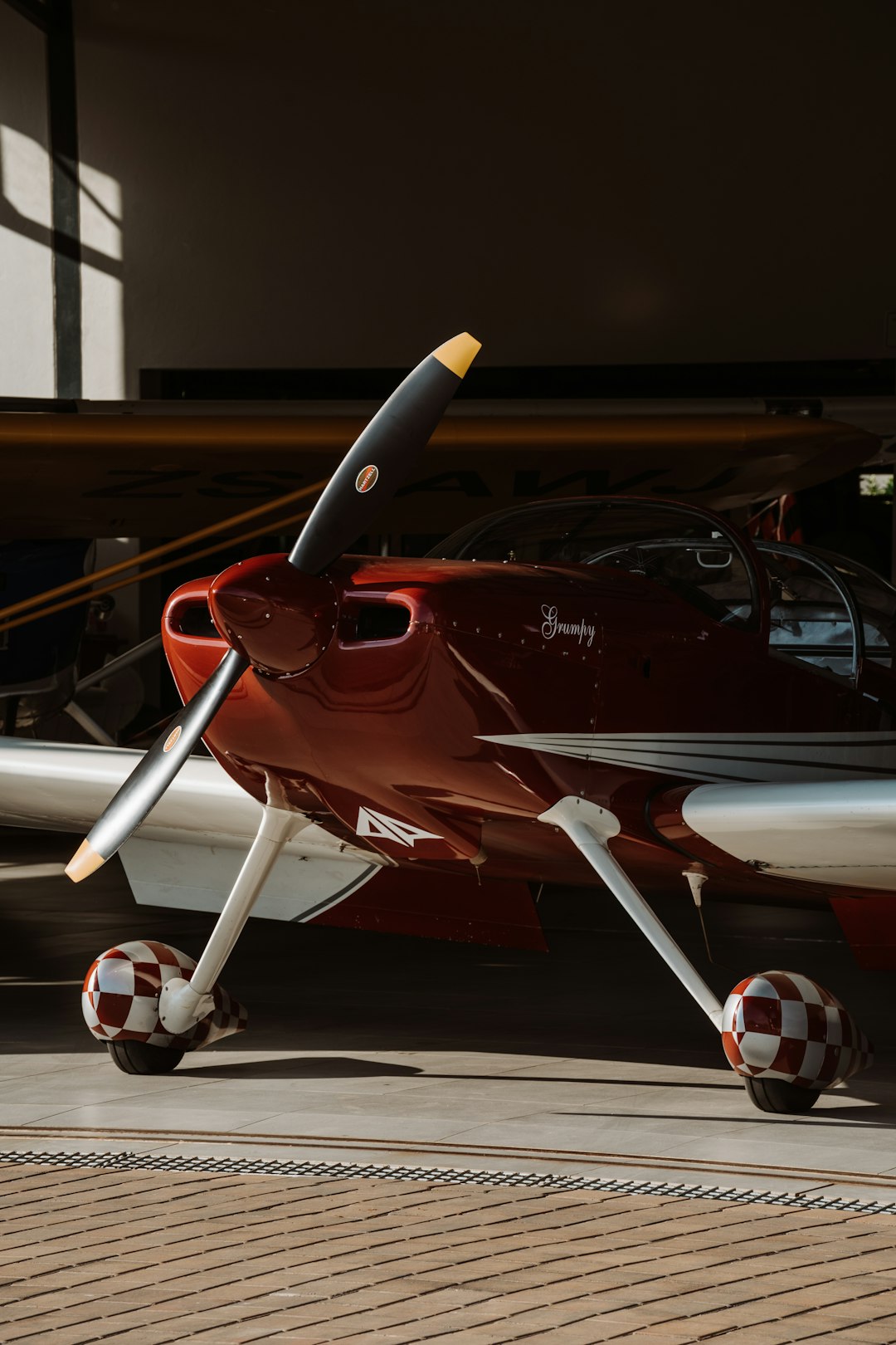 A small propeller aircraft parked on the tarmac